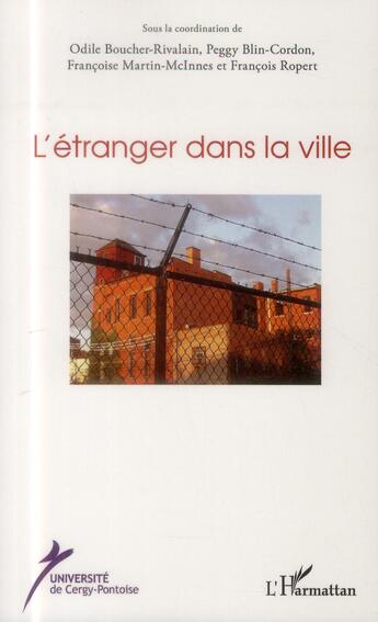 Couverture du livre « L'étranger dans la ville » de  aux éditions L'harmattan