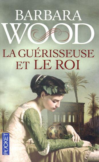 Couverture du livre « La guérisseuse et le roi » de Barbara Wood aux éditions Pocket