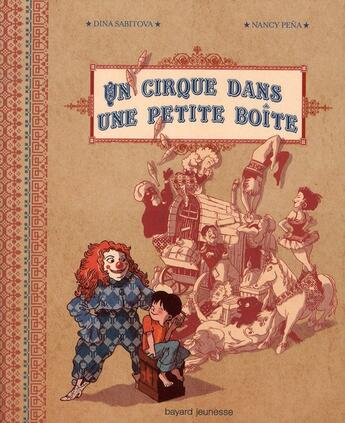 Couverture du livre « Un cirque dans une petite boîte » de Nancy Pena et Dina Sabitova aux éditions Bayard Jeunesse