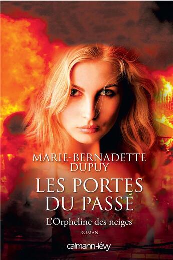 Couverture du livre « L'orpheline des neiges T.5 ; les portes du passé » de Marie-Bernadette Dupuy aux éditions Calmann-levy