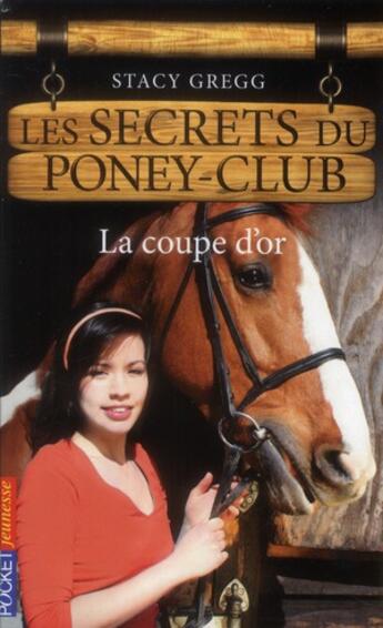 Couverture du livre « Les secrets du poney club t.5 ; la coupe d'or » de Gregg Stacy aux éditions Pocket Jeunesse