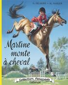 Couverture du livre « Martine monte à cheval » de Marcel Marlier et Gilbert Delahaye aux éditions Casterman