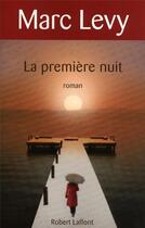 Couverture du livre « La première nuit » de Marc Levy aux éditions Robert Laffont