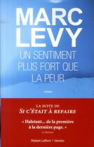 Couverture du livre « Un sentiment plus fort que la peur » de Marc Levy aux éditions Robert Laffont