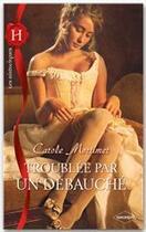 Couverture du livre « Troublée par un débauché » de Carole Mortimer aux éditions Harlequin