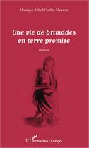 Couverture du livre « Une vie de brimades en terre promise » de Monique Alfred Ondze Abouem aux éditions L'harmattan