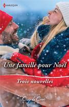 Couverture du livre « Une famille pour Noël : le Noël de toutes les surprises, une étreinte sous la neige, un papa en cadeau » de Carla Cassidy et Marin Thomas et Cathy Mcdavid aux éditions Harlequin