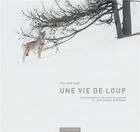 Couverture du livre « Une vie de loup » de Vincent Munier et Jean-Michel Bertrand et Philippe Huet aux éditions Hesse