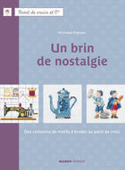 Couverture du livre « Un brin de nostalgie ; des centaines de motifs à broder au point de croix » de Veronique Enginger aux éditions Mango