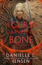 Couverture du livre « A CURSE CARVED IN BONE ; BOOK TWO OF THE SAGA OF THE UNFATED » de Danielle L. Jensen aux éditions Random House Us