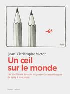 Couverture du livre « Un oeil sur le monde ; l'actualité à travers les dessins de presse internationaux de 1989 à nos jours » de Jean-Christophe Victor aux éditions Robert Laffont