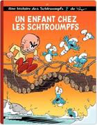 Couverture du livre « Les Schtroumpfs Tome 25 : un enfant chez les Schtroumpfs » de Peyo aux éditions Lombard